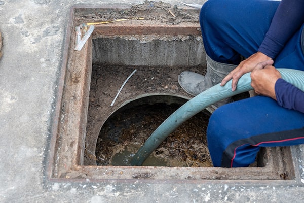 regular grease trap pumping maintenance prevents clogs, foul odors, and potential environmental issues